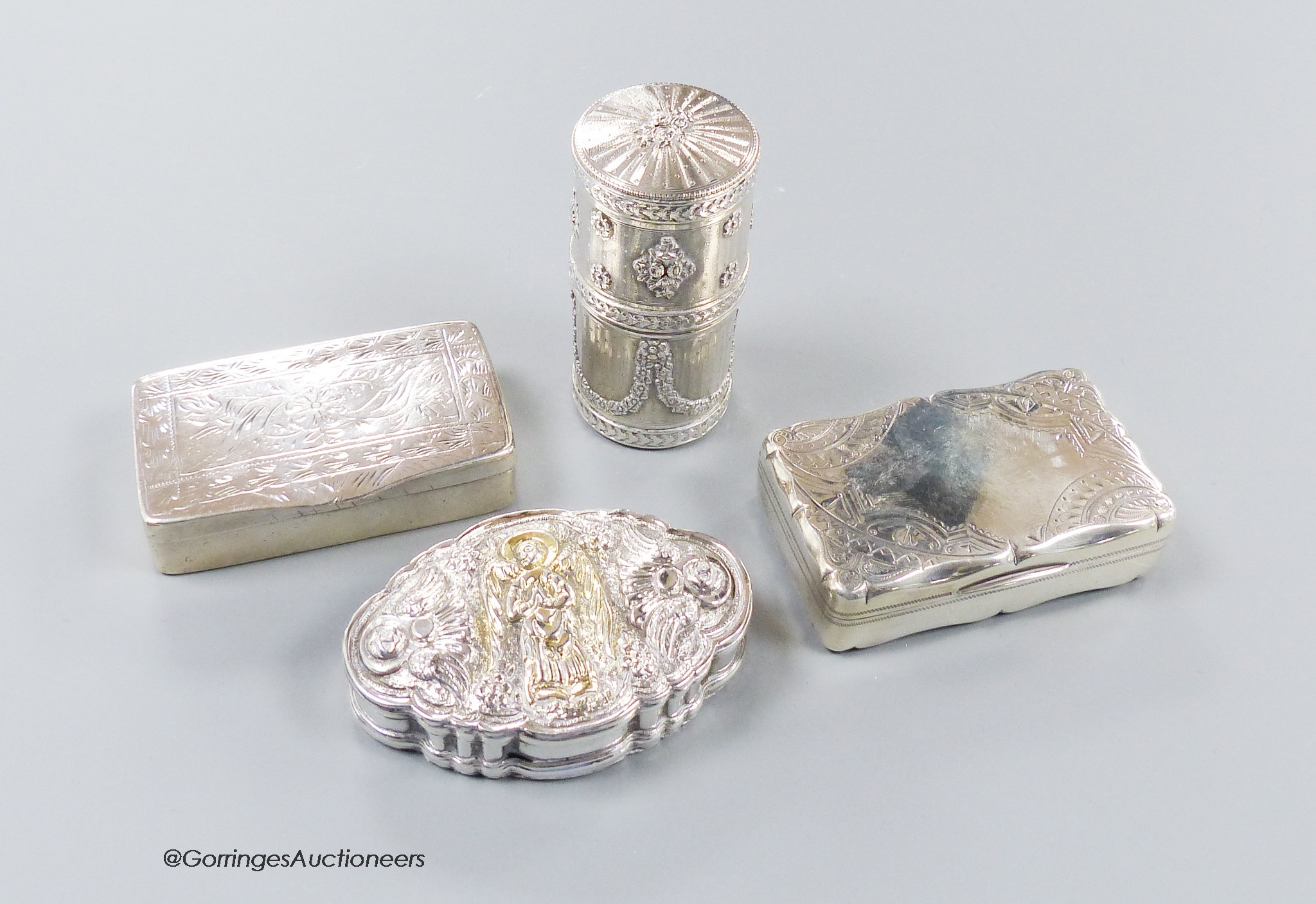An early 20th century French white metal cylindrical box and cover, 72mm and three other continental white metal snuff boxes, including one embossed with an angel, 7.5oz.